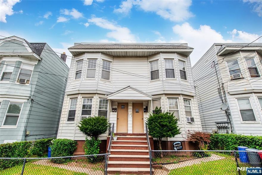 Welcome to this expansive fourplex in the heart of West Orange, an ideal opportunity for both investors and owner occupants! This side-by-side layout offers four total units: three 2-bedroom units and one 3-bedroom unit, each with functional layouts, great natural light, separate utilities, and some recent updates. Making it move-in/rent-ready with upside to increase value and income. Potential rental income of $10,000/month! Transit-friendly location with a NYC bound bus stop right outside your door, and just minutes from the Morris & Essex line, offering Midtown Direct train service to NYC. West Orange also offers free jitney service to nearby train stations. Conveniently located near shopping, dining, schools, and major highways, this property is a true gem!