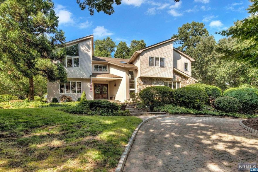 A MOST UNIQUE COLONIAL WITH A PHENOMENAL CONTEMPORARY VIBE SITUATED ON NEARLY 2 ACRES OF PROPERTY TUCKED ON A CUL DE SAC WITHIN CLOSE PROXIMITY OF DOWNTOWN SHOPS, RESTAURANTS & TRANSPORTATION. NEARLY 4,500 SQ FT OF SUNDRENCHED LIVING SPACE MAKES LIFE IN THIS HOME ABSOLUTELY PERFECT. OVERSIZED ENTRY OPENS TO FORMAL LIVING RM W 2 STORY CEILINGS/WINDOWS & FPL, FORMAL DINING ROOM W VIEWS OF THE STONE PATIO/PRIVATE YARD, BILLIARD/GAME RM W WET BAR/ OFFICE, TREMENDOUS KITCHEN W WALK-IN PANTRY, BREAKFAST AREA, SITTING RM W FPL, GREAT RM, & POWDER RM. THE 2ND FL OFFERS A COMPLETELY PRIVATE PRIMARY SUITE W FABULOUS CLOSET SPACE & FPL, SPA-LIKE BATH W FPL, ENSUITE BEDROOM/FBA, BR, BR W LOFT, FULL BATH, & LAUNDRY. FINISHED LOWER LEVEL AS THE PERFECT REC RM, GYM, WET BAR, FULL BATH, OFFICE/GUEST RM, STORAGE, & ACCESS TO 3 CAR GARAGE. PERFECT OUTDOOR ENTERTAINING SPACES - COVERED PATIO, STONE PATIO W FPL, & TREMENDOUS YARD. ADDITIONAL STORAGE. GREAT LOCATION!