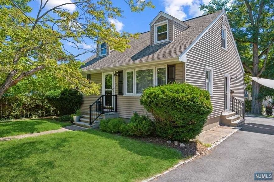 Modern, manicured & move-in ready! You will fall in love w/this COMPLETELY RENOVATED Cape Cod boasting an array of sleek finishes & a thoughtful, open plan layout. Situated on a manicured lot w/a deck and a fabulous backyard patio. It is conveniently located near schools, walking distance from rest, stores, direct train station to NYC & all the amenities this desirable community has to offer. Standouts include hardwood floors, a cool, calming color palette, a large eat-in kitchen, a finished basement & a backyard oasis. Stylish eat-in kitchen w/crisp, white wooden shaker style cabinetry, quartz counters, subway tile backsplash & SS appliances. The beautifully inlaid hardwood floor anchors a generous open dining area. New TREX deck w/waterproof storage underneath. Spacious primary Bd suite complete with dormer windows, a WIC & a full en suite bathroom.Even more living space in the finished basement incl a large family rec-room with a bar, 4th Bd, 1/2 BTH, laundry and ample storage.