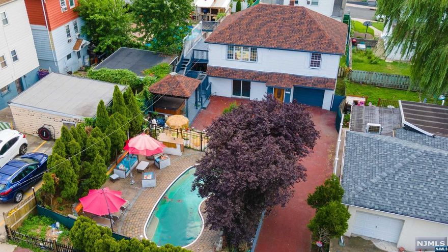 Fantastic 1 family home - Main level offers extended-family style - features 1 spacious bedroom, 1 full bath. Second floor offers 2 bedrooms, 1 full bath, open concept w/modern eat-in kitchen, living room and large dining room. Hardwood floors throughout first floor, marble flooring on 2nd level. Magnificent yard, great for entertaining with a large in-ground pool and spa hot tub. Large driveway with 1 car garage. Outside driveway additional 3 parking spaces. Situated on a double lot! Calling all investors! SOLD AS IS. Come see the value this home has to offer in one of the most desired commuter towns in NJ.