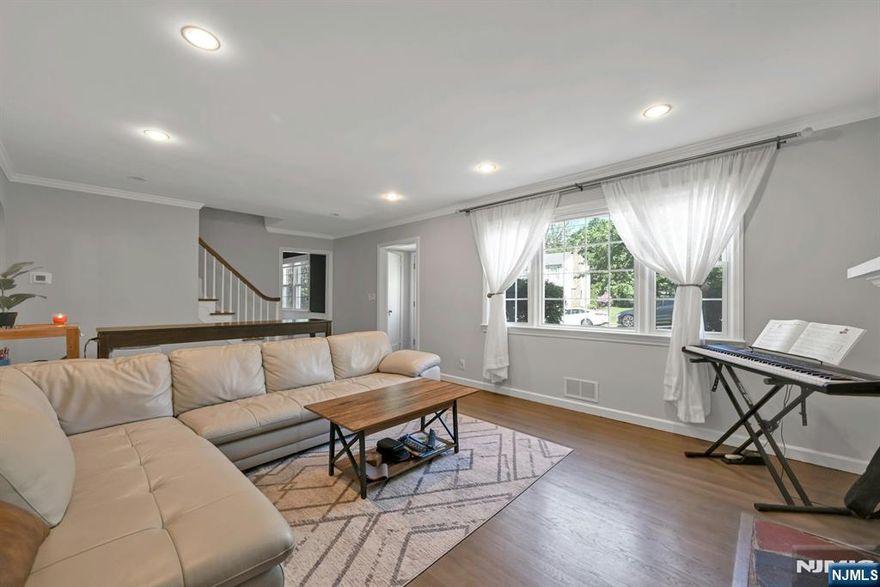 Come see this wonderful residence filled with light, comfort, and an oversized property that offers room for future dreams. Oradellâ€”where tree-lined streets, top-rated schools, and a true sense of community create a coveted lifestyleâ€”this home is a must-see. Step into an inviting entry foyer with a coat closet, leading into a bright living room with fireplace. Formal dining room and a spacious kitchen complete with sleek, two-year-new stainless steel appliances and plenty of cabinet space. Just beyond, a sunny enclosed porch wrapped in windows offers peaceful, year-round views of lush parklandâ€”perfect for morning coffee or quiet afternoons. The main bedroom is followed by a fully renovated bath. Upstairs, two spacious bedrooms share a second full bath. The finished lower level is full of possibilitiesâ€”ideal for a playroom, or peaceful retreat. With high ceilings, a full bath, utility room, and direct walk-out access, it opens to a private backyard that truly sets this home apart. Larger than most in the neighborhood, the yard is framed by mature trees, offering both space and privacyâ€”whether for summer gatherings, a garden, or future expansion. Recent upgrades include a new roof (2022), new outdoor condenser and thermostat, HVAC tune-up, fresh interior paint, and refinished hardwood floors. A classic detached two-car garage and minutes to close shops, restaurants, and transportation