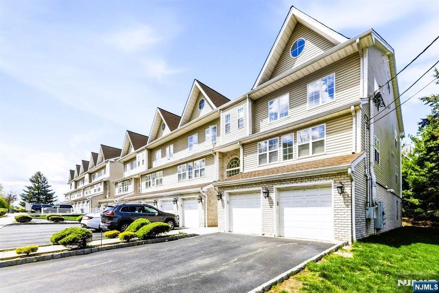 Stunning multi-floor end-unit filled with natural light, offering a spacious open floor plan and modern finishes throughout. The kitchen features granite countertops, stainless steel appliances, and a breakfast bar, perfect for everyday living and entertaining. The 2nd floor features a large loft bedroom with plenty of closet space and an additional bonus room, ideal for a home office, gym, or walking closet, with potential for further customization. Enjoy beautiful views from your private balcony, along with high ceilings, full-size washer and dryer, and abundant closet space. Additional highlights include a garage with storage room and a private driveway accommodating up to 2 vehicles. Low HOA adds to the overall affordability and appeal. Conveniently located near Garret Mountain Reservation, one of New Jerseyâ€™s National Natural Landmarks, offering trails, athletic fields, fishing, picnic areas, and more. Close to shopping, dining, public transportation, major highways, and just minutes to the train station for an easy commute to NYC.