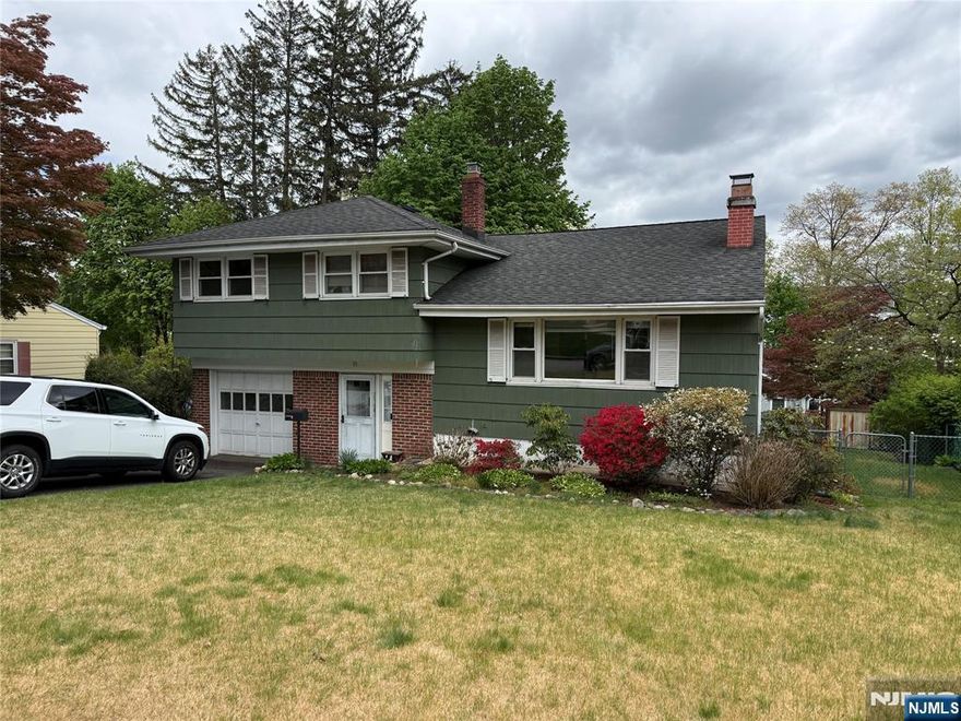 Split level on a quiet street. Freshly painted. Hardwood floors throughout. Gas baseboard heating SYSTEM. Central air. 1 car garage attached. great potential. Sold as-is