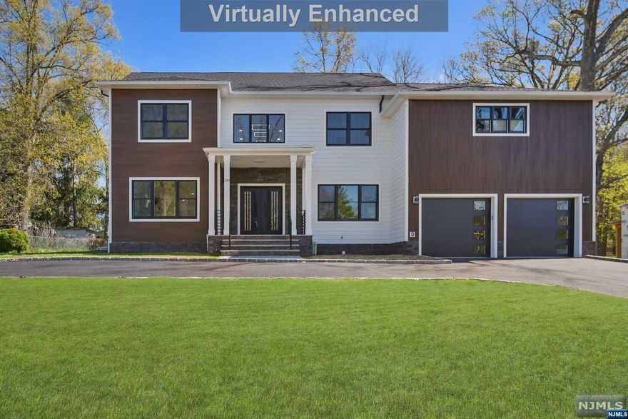 Stunning custom built 6BR/5.5BA colonial with 5000+ sq ft of living space set on .36 acre lot in the best location of the best town!This home boasts spacious open floor plan,1st floor in-law suite and office, Livingroom, family room and formal dining room, The kitchen is complete w high-end SS appliances, center island ,quartz counters, custom cabinets. The 2nd floor is home to 4 bedrooms, luxurious master suite , 2nd bedroom has its own en-suite, 3rd & 4th beds share a bath, laundry. Fully finished basement with 9' ft ceilings, Mud room, Media room, Rec room and Full bath. To be completed December 2023. Must See!!!