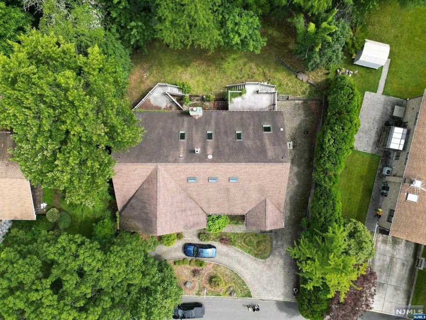 Welcome to 239 Fairview Ave, located on a dead end street in the highly desirable North Cliffs section of Englewood Cliffs. This home features 7 bedrooms, 5 full and 1 half bathrooms spanning across an approximate 6,800 square foot bi-level home set on over 1/3 acre. The home needs extensive renovations and is for sale strictly in As-Is condition. Please refer to floor plans for layout. It is also listed as Land. Do NOT enter property without Listing Agent present.