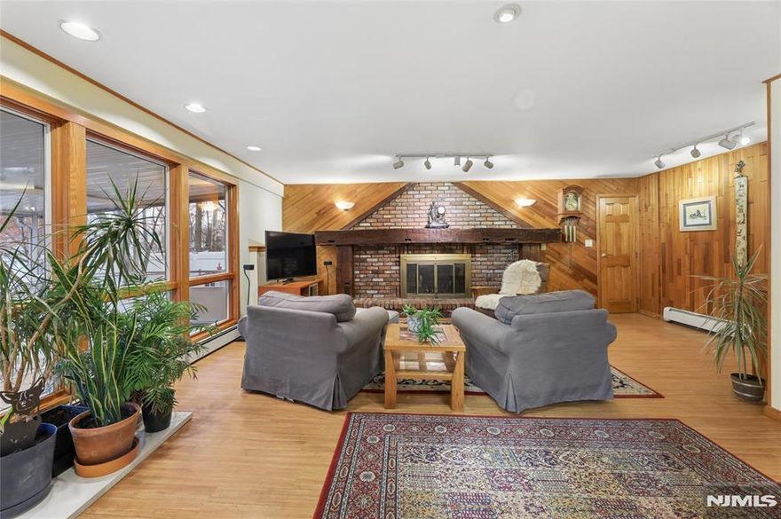 Imagine enjoying your morning coffee in a peaceful screened-in porch or relaxing by the wood-burning fireplace on a chilly evening. Welcome to this inviting home with unique features set on a desirable corner lot property. You will find classic style and everyday convenience in this beautiful 3-bedroom, 1.5-bath home. Located in the heart of Oakland, you'll be just minutes away from schools, shopping centers, parks, houses of worship and NYC transportation.Interior Highlights: Inviting Living Spaces: The spacious living room features vaulted beamed ceilings. Step down to the cozy family room boasting a unique decorative wood and brick accent wall with a wood-burning fireplace and honed mantel perfect for chilly evenings. Open & Airy Layout: Enjoy a seamless flow between the living room, dining area and kitchen, ideal for both daily meals and holiday hosting. Outdoor Living: Relax in your private screened-in porch or head out to the patio " perfect for summer BBQs, outdoor fun or just relaxing. Nestled in a desirable Oakland neighborhood with convenient access to everything you need, this home offers comfort, charm and an unbeatable location. Come and see why this home feels special the moment you walk in.