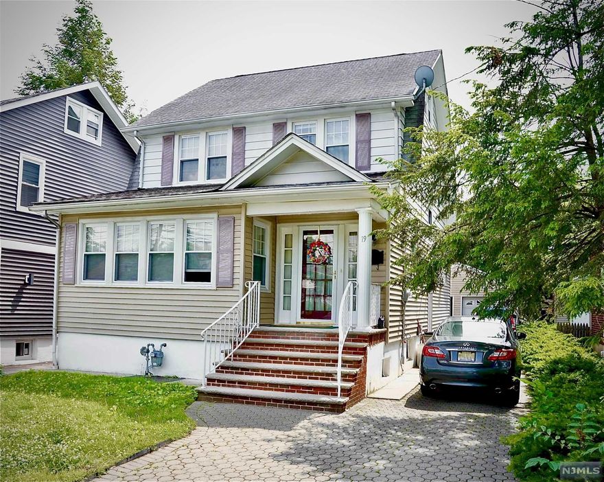 Welcome to this immaculate beauty located in sought after neighborhood. Close to parks and transportation. Open the door to a formal living room, dining room, family room, eat in kitchen. This home boasts beautiful hardwood floors, 4 bedrooms 2 baths, plus 2 bonus rooms in the finished basement. Nice sized deck leads into backyard. The long driveway boasts pavers with a garage in the end. Come see this charming home on a quiet street with a so much to offer!