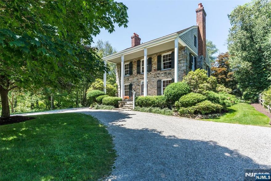 Welcome to the First House Built in Smoke Rise. This Stunning Stone Colonial Home Built in 1880 is the Perfect Blend of Architectural and Historic Charm Mixed with Modern Conveniences & Meticulously Renovated. The Beautiful Dutch Door Sets the Tone with High Ceilings, Intricate Moldings, Wood Floors, Wide Window's, Custom Draperies, Gorgeous Wallpaper, 5 FRPL'S and Original Details Throughout. Elegant DR & LR w/ a Fireplace. An Updated Kitchen w/a Former FRPL now, with an Antique Woodstove w/a Built in Gas Cooktop, Sub Zero Refrigerator, Soapstone Countertops, Wall Oven and a Center Island with a Farm Sink. A Bright Family Room with Walls of Windows, a Wet Bar & Powder Rm. A Beautiful Primary Bedrm w/a FRPL, Walk in Closet & a Luxurious Designer Bath. A Cozy Library with Custom Built - Ins, & a FRPL for Relaxation. There is a 2 Car oversized Garage, Circular Driveway with Crushed Stone to Emulate the 18th Century. Sweeping Grounds with Mature Trees & Lush Gardens. An Original Well House with Belltower, a 7-person Saltwater Hot tub, Patio, Deck, Terraces & Views of the Woodlands & a Very Tranquil Stream. If the Electric goes out, No Problem there is a 10 KW Backup Generator. Smoke Rise Offers a Distinctive Lifestyle in a Premier Gated Residential Club Community, with a 120-acre Lake, Numerous Social & Sporting Amenities and The Elegant Village Inn. Kinnelon Offers a Top-Rated School System & is only 35 Miles from NYC. Close to Transportation, Shopping, Parks.& Golf Courses