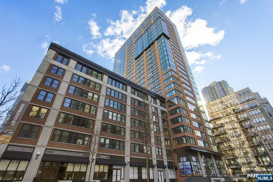 Bright 2 beds/ 2baths layout corner unit (1141 sf) in a luxury building built by Toll Brothers. It's in the heart of downtown, Jersey City close to restaurants, markets and coffee shops with Whole Foods. The Grove Street PATH station is only 2 blocks away, making it easy to commute to the WTC area in 10 minutes. The building features 24-hour concierge service, 27,000 SF amenity of the art Gym, Yoga room, private resident's lounge, game room, outdoor pool and beautifully landscaped rooftop gardens/terraces with unobstructed NYC and Hudson River views. Sundecks and Courtyards featuring an Open-Air Fireplace & BBQs, and Children's playroom. Home features a great open layout. Thermador & Bosch appliances, quartz countertops, full-sized vented washer/dryer in the unit, wide plank wide oak floors, Central A/C, custom cabinets, and amazingly oversized windows which floods the home with light. Enjoy a gorgeous waterfront promenade all within close distance for the ultimate in convenience.