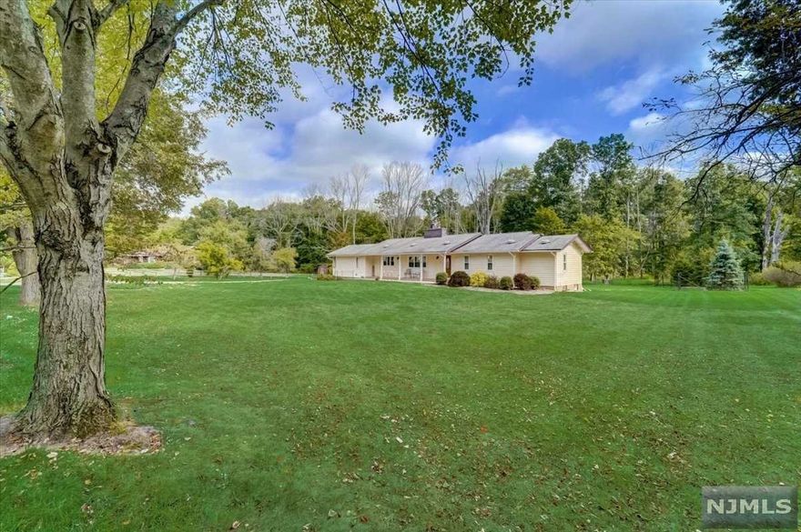 Lovely ranch home sitting on close to an acre of land in the Troy Hills section of Parsippany. Set on a cul-de-sac road very private, yet close to major highways for an easy commute. The home has had numerous upgrades done from new electric, land professionally excavated for drainage and so much more. The ranch style house offers spacious living room with fire place, kitchen, 3 bedrooms and 2.5 baths. Bonus family room in basement and full bath. Plenty of storage in basement and close to 2000 sq ft of attic storage.