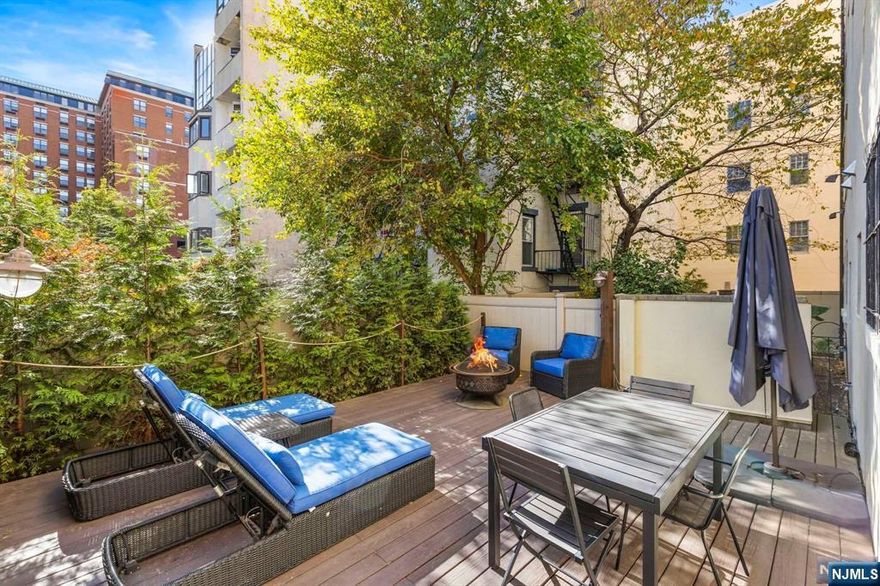 This beautifully designed one bedroom condo offers a 500 square foot landscaped private deck. . As you enter, you'll be greeted by soaring 11' ceilings, hardwood floors and three expansive California-style closets. The luxurious, private bathroom boasts heated floors for added comfort.