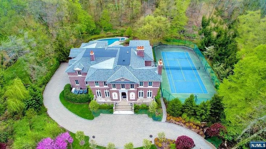 SET HIGH ON DEMARESTS EAST HILL, THIS ALL BRICK MASTER PIECE SCREAMS PRIVACY SECLUDED AND SURROUNDED BY NATURE!CUSTOM HOME BY JAMES PARAGANO SITS ON OVER 1 ACRE OF LUSH MANICURED GROUNDS EQUIPPED W/ POOL & TENNIS. HIGH CEILINGS THROUGHOUT THE HOME, EXTENSIVE TRIM AND CROWN MOLDING FINISHES. CHEFS KITCHEN WOLF & SUB ZERO APPLIANCES. OPEN CONCEPT LIVING. ALL BEDROOMS FEATURE EN-SUITE BATHS AND WALK-IN CLOSETS, ELEVATOR, INDOOR CABANA, BILLIARDS ROOM, HOME THEATER, WINE CELLAR, LOWER LEVEL GYM/SAUNA/SPA, OUTDOOR KITCHEN & LOGGIA POOL WITH SPA, TENNIS COURT. HOUSE HAS FULL GENERATOR, FULLY FENCED BACKYARD A PERFECT HOME FOR EVERYDAY LIVING/WORKING CLOSE TO CLOSTERS DOWNTOWN CENTER, WHOLEFOODS, STARBUCKS RESERVE, SCHOOLS, PARKS, & HOUSES OF WORSHIP. 7 MILES TO GEORGE WASHINGTON BRIDGE