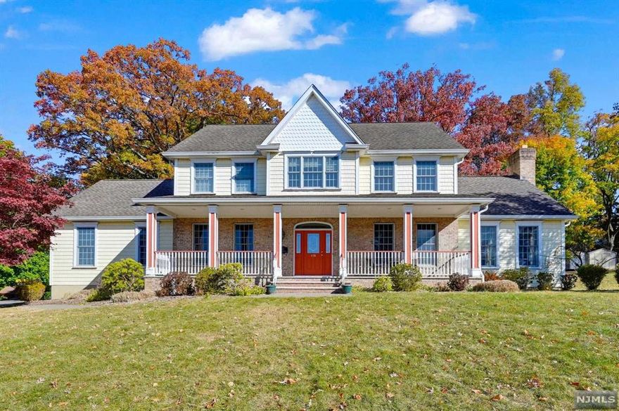 Expansive 4,000sf Farmhouse Center Hall Colonial set on 1/2 acre+ property. Open front porch welcomes you into the entry foyer leading to the living room, dining room, large center island kitchen with breakfast bar and eating area which opens to the vaulted Great Room with fireplace, 2nd family room, laundry room and powder room. There is a first floor bedroom with full bath --perfect for extended family or guest suite. Upstairs offers a large primary bedroom with walk-in and private bath, two generous bedrooms and an sun filled office (could be bedroom) and main bath. Huge basement with high ceiling--waiting to be finished and an oversized 2-car garage. Hardwood floors, high ceilings, lots of windows and space galore. Convenient to downtown shopping and restaurants, top-rated Park Ridge schools, and NY transportation.