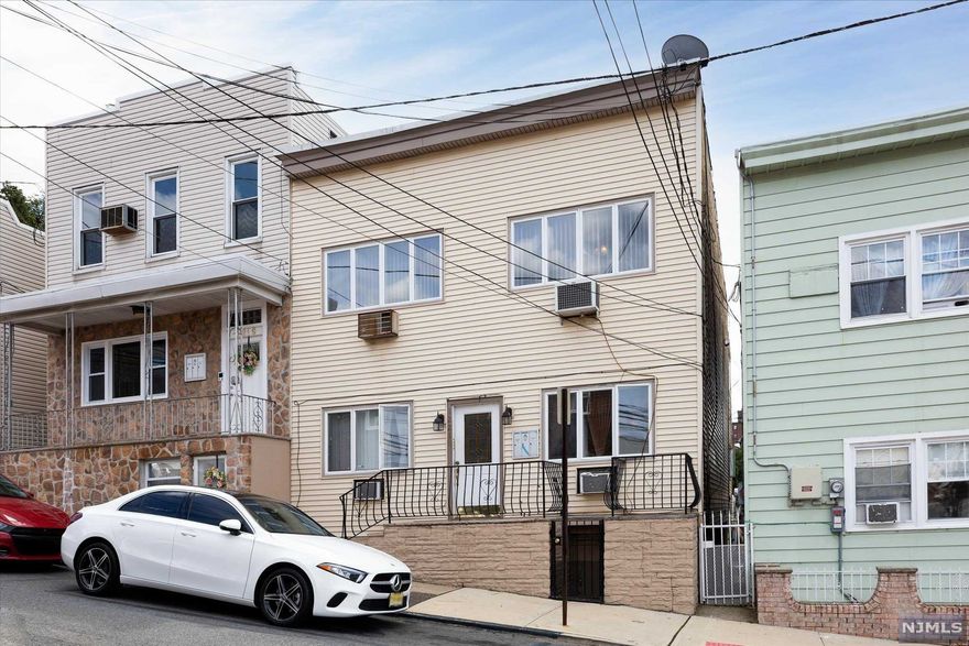 Spacious 3 family home waiting for its new owner! Beautifully updated 2nd floor offers 2 bedrooms, fully renovated kitchen and bath, plus large Living Rm, Dining Rm AND Family Room. The private deck completes this great apartment. The 1st floor offers two additional units: there is a studio with a lovely deck off the kitchen, perfect for that morning cup of coffee! The 2nd unit on the 1st floor includes a Living Room, Dining Room, Kitchen, Full Bath and bedroom. The full, walk-out basement is also finished with a full bath, utilities and laundry. With its close proximity to NYC, public transportation, parks, shopping and more, this is truly a must see!