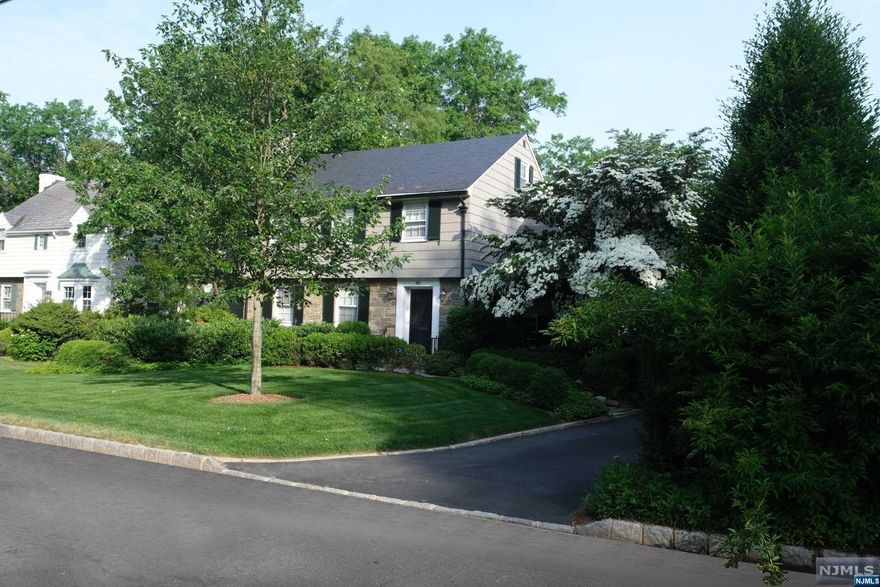 A masterpiece of luxury nestled in the Hartshorn section of Short Hills, where every detail reflects unparalleled craftsmanship. With 5 bedrooms, 3 full and 2 half baths, this home combines classic elegance with contemporary comfort. The heart of the home boasts top-tier appliances and marble countertops, making it a chef's delight. This culinary haven seamlessly opens to a family room, where comfort meets luxury, ideal for hosting or tranquil evenings. The dining room, a harmonious blend of sophistication and warmth, awaits your celebrated occasions, surrounded by windows that frame the idyllic outdoors. The living room, anchored by a wood-burning fireplace, becomes a cozy refuge for intimate gatherings or quiet moments alone. Upstairs, the bedrooms emerge as sanctuaries of peace across two levels, each accompanied by ample closets and walls of windows that promise relaxation.