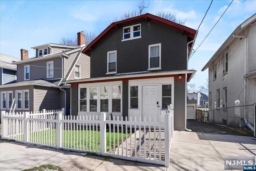 Walking in through the enclosed porch you are welcomed by a large and inviting living room. The first floor has an open concept featuring kitchen, dining room, living room, and half bathroom. The tastefully renovated kitchen features granite countertops, newer cabinets, stainless steel appliances, tiled backsplash and a breakfast bar. The second floor entails 3 bedrooms and a full bathroom. The third floor features an unfinished attic with additional storage space and the second heating unit. The basement is spacious and open with an additional half bathroom. 2 zoned forced hot air and central air throughout. Many upgrades throughout this home such as recessed lighting, and updated flooring. Close to transportation, parks, and NYC. This is a must see!