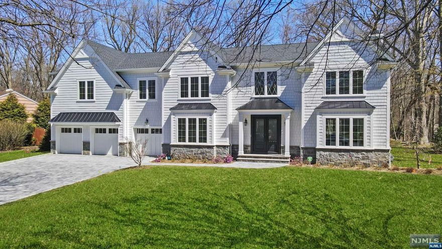 Stunning new construction colonial w/6 BR, 5 full BA, over 7000sq ft of living space on 3 Fls, built by a lux builder w/over 30 years of experience. Exquisite property on a completely flat .79 acres offers total privacy. Enter through DBL iron doors into 2 story EF w/soaring 19 ft ceilings & natural light. Open concept KIT & FR overlooks the flat yard. Chef's dream KIT ft SS appliances, oversized island w/Quartz counters & glass sliding door to patio. FR is perfect for entertaining w/Gas fpl, coffered ceiling, herringbone fl's & opens to LR. Mudroom w/custom cabinets offers easy access to the GAR & BKYD. 1st Fl is completed w/full BA & BR. 2nd Fl w/ Lux primary suite ft gas fpl, 2 custom WICs & primary bath w/soaking tub, 2 vanities, oversized shower w/bench. LL offers ADDL living spaces w/rec room, office/media room w/custom built-ins, 2 bonus rooms & full BA. Beautiful park-like property w/room for a pool. Close to all Old Tappan schools & only 30min from NYC. Don't miss out!