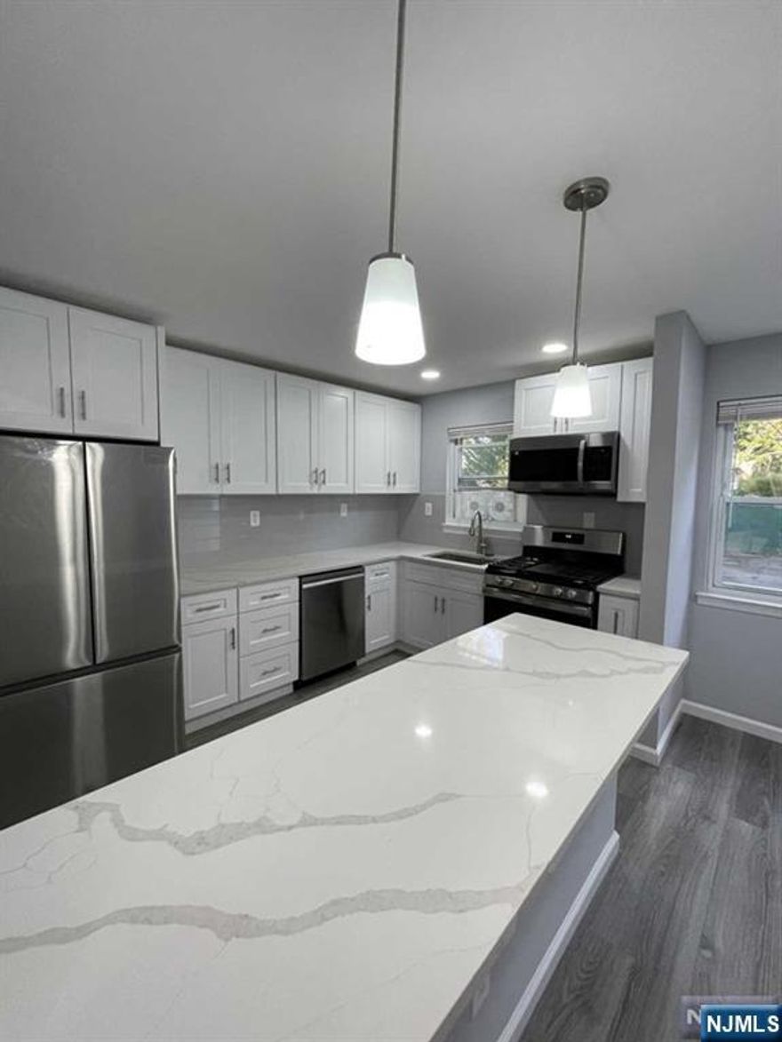Totally Renovated(2023) 2 Bedrooms 1 Full Bathroom End Unit. New Kitchen with New Appliances, New Flooring, and New Full Bathroom. Very Quiet, Sunny, and Bright 1st Floor. 951 living sqft. Baseboard Heating, Hot Water, and Parking are Included in the Rent. Close to Express NYC Bus, and School.