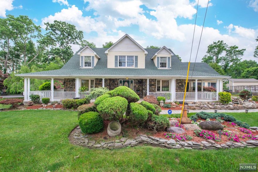 Curb Appeal Galore adorns this Welcoming & Impressive custom home. Maticuloulsy maintained & landscaped w/soothing water features surrounding the expansive maint free front porch complete w/recessed lightings providing wonderful additional outdoor living space. HW throughout 1st floor, LR has beautiful stone wood burning FP surrounded by windows lending plenty of natural light. Large open eat-in kit has center island breakfast bar w/sink, new appliances, abundance of cabinet space, Anderson sliders to expansive trex deck, access to sunroom w/heat & air, & bonus mud room leading to 2 car garage. First floor laundry room is a plus. The primary bedroom complete w/custom walk-in closet & master bath w/ jacuzzi tub. 2nd level offers Full Bath, 2 generous size bds, each w/cozy nook space, skylights & 2 closets each. The 2nd level sitting room can be easily converted to 4th bd. Plenty of storage in the walk-in attic. Full unfinished basement w/tall ceiling has endless pos.