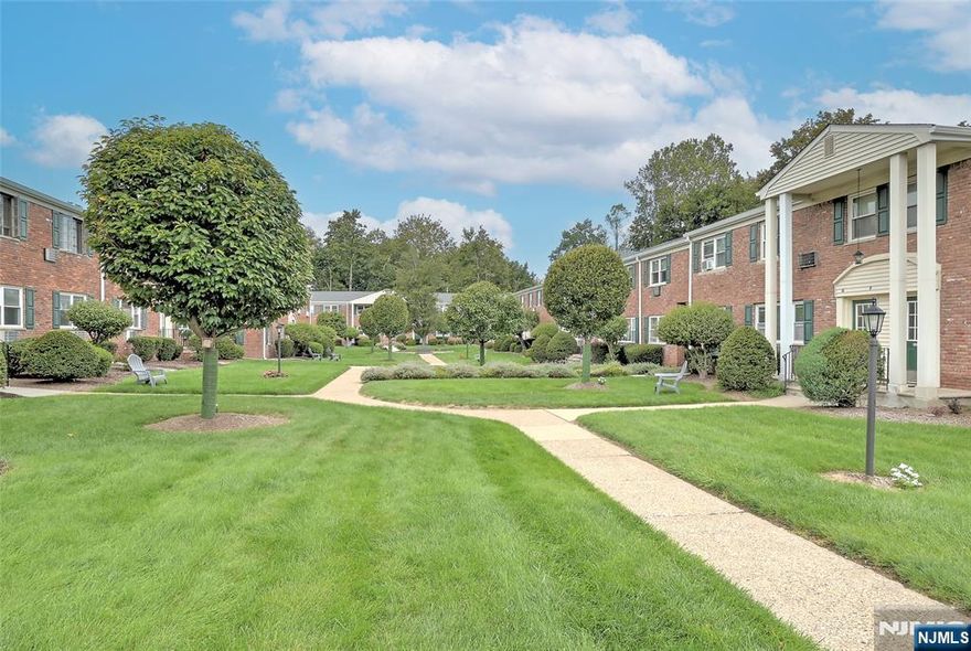 Sunny First-Floor 1-Bedroom Condo in the Heart of Caldwell - This freshly painted condo combines charm, ease, and convenience in one of Caldwell's most desirable locations. Set on the first floor of a garden-style complex, it features hardwood floors, ample closets, and sun-filled spaces that create a cheerful, welcoming atmosphere. The living room flows into a dining area perfect for everyday meals or quiet evenings in. A spacious bedroom with walk-in closet offers a comfortable retreat, while on-site laundry, a designated parking space, and low-maintenance living add to the appeal.Low HOA fees (including heat and hot water) plus modest taxes make this an easy choice. Just a block away, Caldwell's shops, cafes, and restaurants await. Nearby, the Olmsted-designed Grover Cleveland Park provides trails, courts, playgrounds, and open fields. With NYC transportation nearby on Bloomfield Ave, this condo offers a rare blend of small-town charm and city convenience. Square footage is approximate. Assigned parking space number 7.