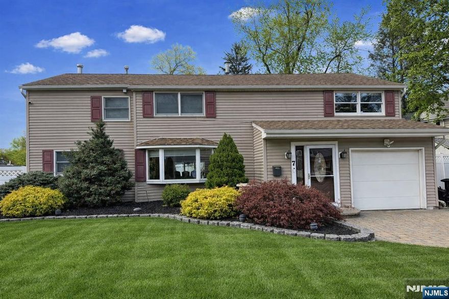 Waldwickâ€™s best-kept secret has officially hit the market. This beautifully renovated 3,200 sq ft home offers the rare combination of space, warmth, and modern open-concept living. The stunning high-end kitchen anchors the main level with a generous breakfast area and bar, flowing seamlessly into the open dining and living spaces allows natural light to flow through the home and create an effortless environment for both everyday living and entertaining. A cozy family room with a gas fireplace sits just beyond, with sliders leading to a fully fenced backyard and a large patio perfect for summer gatherings. Convenience shines with first-floor laundry, a powder room, and a mudroom designed to keep daily life organized. Upstairs, the primary suite is a true retreat, featuring two oversized walk-in closets and a spa-inspired bath complete with a jetted tub for two and a rain shower. Three additional bedrooms each offer spacious walk-in closets and share a beautifully updated main bath. The finished basement adds two versatile bonus rooms ideal for work, play, fitness, or media. Outside, the home offers a one-car garage plus driveway parking for up to five vehicles. Set on a generous lot in one of Bergen Countyâ€™s most beloved towns, this home checks every box for comfort, style, and modern living. Professional photos coming soon â€” this one wonâ€™t last !!
