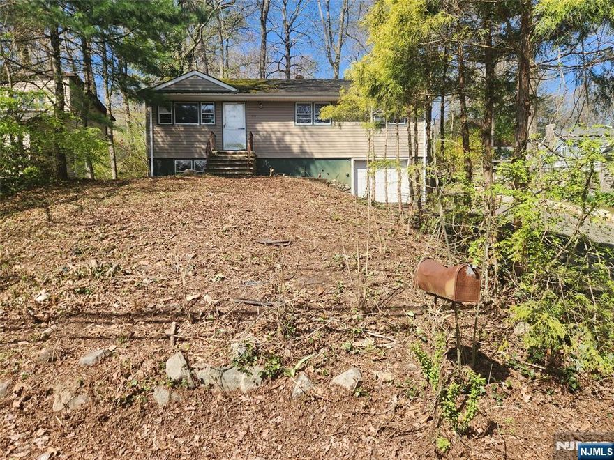 Bring this raised ranch lake house back to its glory! With some TLC this home will be your summer joy for a lifetime. First floor features 3 bedrooms and 1 full bathroom. Kitchen, living & dining area. Basement is fully finished with attached garage allowing walk out access. 3 car parking driveway. Home has optional lake rights for Cupsaw Lake. Home features forced hot air. Window a/c.