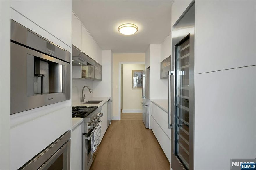 FOR THOSE WHO EXPECT MORE Experience effortless luxury in this exceptionally renovated three bedroom, two-and-a half bath residence at Horizon House Towers-offering over 2100 sq ft of expansive ranch style living-Truly a home in the sky .Every inch of this residence has been thoughtfully redesigned-The chefs kitchen is a standout, featuring high end stainless-steel Thermador appliances, unique wine cooler ,and sleek custom cabinetry-perfect for entertaining or every day enjoyment-Wood plank flooring flows seamlessly throughout the entire home, creating warmth and continuity-All the bathrooms have been completely renovated showcasing custom walk in showers, floating vanities, Porcelanosa tile and refined designer hardware for a spa like experience-Abundant storage with all custom closets and fabulous built ins offering both beauty and functionality-Enjoy indoor-outdoor living with two terraces-ideal for morning coffee, evening relaxation, or taking in the breezes-Additional highlights include garage parking, 24 hour doorman and security and access to 28 acres of beautifully landscaped grounds-Two outdoor pools, tennis courts, gyms and more-delivering a true resort lifestyle just minutes from Manhattan- Move in and start your new lifestyle This is a home that truly must be seen to be appreciated - Exceeding Expectations -Sophisticated living- Move in and start your new lifestyle in this vibrant community