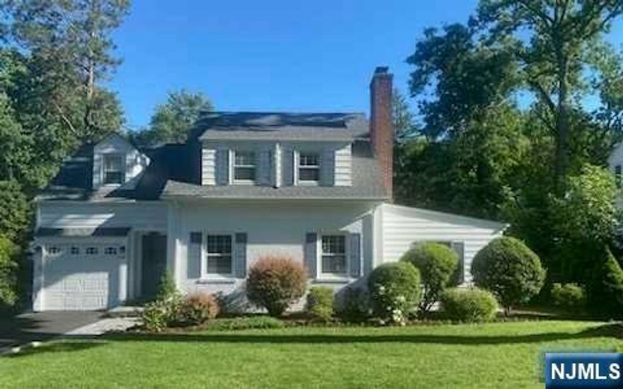 Welcome to Tenafly's most charming home! Upon entering through the vestibule you are greeted by the inviting, sun filled formal living room with wood burning fireplace. The sun filled dining room opens to the kitchen, which has been beautifully renovated with top of the line appliances, including a 6 burner Wolf gas range. The powder room and further family room/den with glass sliding doors to the backyard and deck complete the first floor. The second floor features 2 good sized bedrooms and a generous primary bedroom with a large walk in closet. An updated bathroom services the 3 bedrooms. In the finished basement you will find a further full bathroom, laundry and open space perfect for a play area or hang out space. The house has been immaculately maintained and is set on a gorgeous quiet neighborhood street, stone's throw to Stillman Elementary.