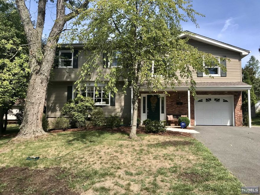 Welcome home to this spacious, well maintained 5BR/2.5BATH split level. Inviting foyer leads to the den, half bath, laundry room and garage. First level features living room with large bay window, dining room, and eat in kitchen with stainless steel appliances and granite countertops. Second level has 3 bedrooms and full bathroom. Third level features a primary bedroom, with full bath and walk in closet as well as one additional bedroom. Enjoy a private back yard, paver patio and large front and side yard for plenty of room to enjoy the outdoors. A custom shed for all of your storage needs, and outdoor projects is waiting. Desirable neighborhood, top rated schools. Minutes to shopping, restaurants, Whole Foods, major highways and NJ Transit Bus and Transit. Don't miss out on this fantastic opportunity!