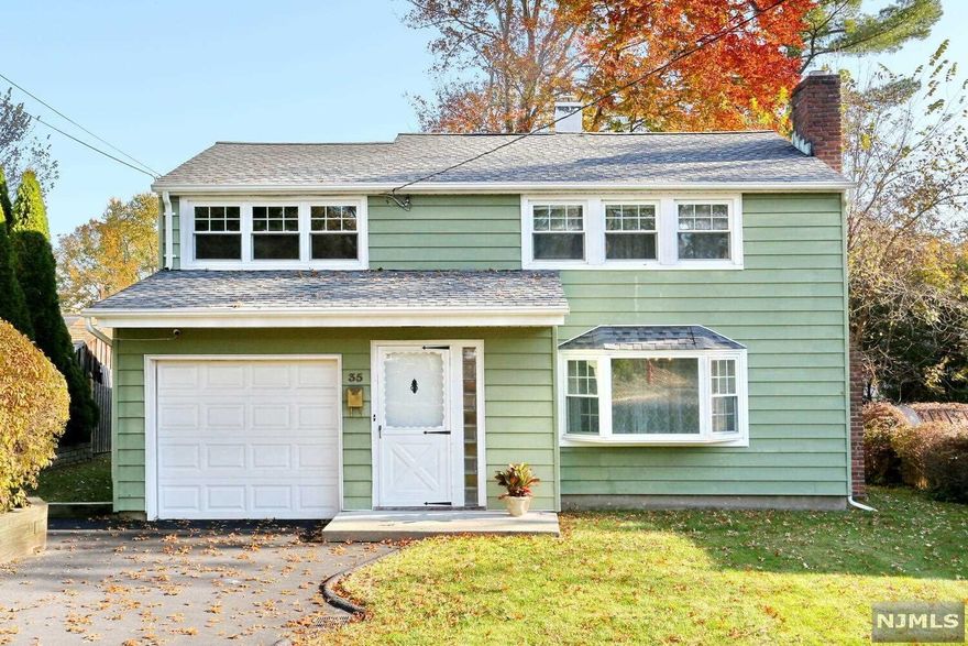 Curb appeal plus with this lovely 3 bedroom, 1 bath Colonial home in the sought after town of Waldwick. The first floor features an entry foyer with double closet, spacious living room with fireplace, dining room, kitchen, laundry/mud room and attached 1-car garage. The second floor offers a primary bedroom, 2 additional bedrooms, full bath and an attic for additional storage! You will love the bonus space included with the 3-season porch off the dining room. The private yard is ideal for entertaining and play. There is much to love about this home including hardwood floors, newer roof, furnace and A/C. Nestled in a quiet neighborhood bordered by Ho-Ho-Kus and Saddle River, this home is in an ideal location in the Traphagen Blue Ribbon school district with close proximity to town park and transportation. A wonderful place to call home - come visit today!