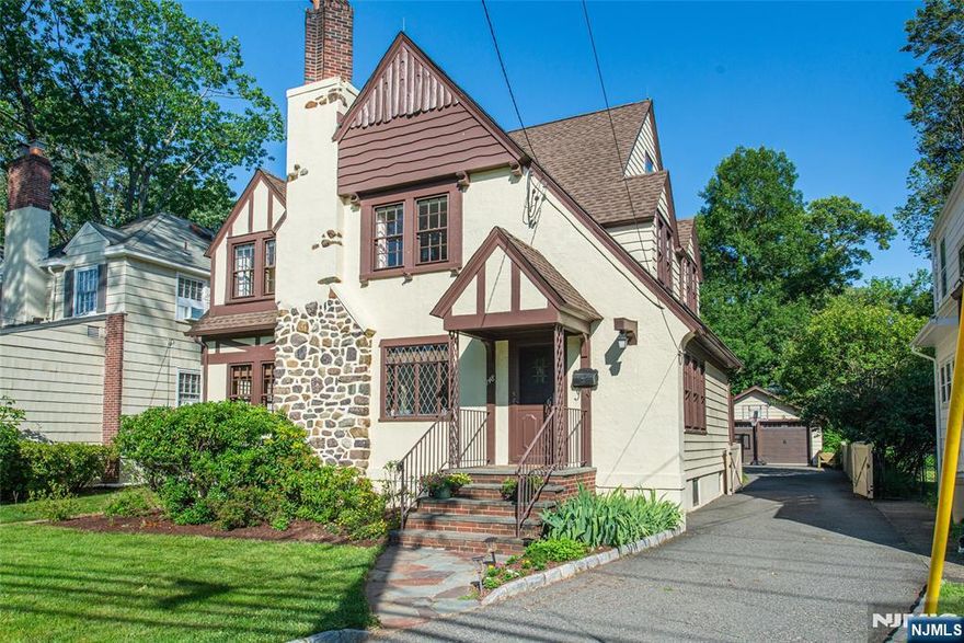 This Turn key, Move-in Ready Storybook Tudor is sure to check off A LOT of boxes on buyers' wish lists! Located in the highly sought after Lincoln Elementary School district & just around the corner from popular Fransisco Park, this 4 bed 1.5 bath packs a punch with over approx 2,000 sq ft of space & no shortage of charm & character. Beautifully maintained & lovingly restored Chestnut crown molding & Chestnut wood surround windows & doors along with arched doorways & hardwood floors throughout. Spacious living room feat. Fireplace w/ original wood mantel, adorable window seat, expansive formal dining room perfect for hosting opens to Den/office/playroom area. Spacious eat-in kitchen w/cherry cabinets, granite counters, SS appliances & Butler's pantry. Convenient powder room completes the 1st floor! 2nd floor has 3 generously sized bedrooms, tons of closet space + updated main bath w/ marble tile w/ walk-in shower + soaking tub. The 3rd floor is such a bonus!! High ceilings w/ 4th bedroom & bonus space (game room, office, gym, playroom).Step outside onto the oversized Trex deck & enjoy the deep level yard, a perfectly private oasis. 2 car garage, full basement w/ workout area, rec room, laundry & tons of storage space! The West Caldwell lifestyle features convenient access to the best restaurants and pubs in Caldwell's famous downtown, top rated schools, parks, 2 town pools, NYC transportation, free summer concerts at the Gazebo and so much more!