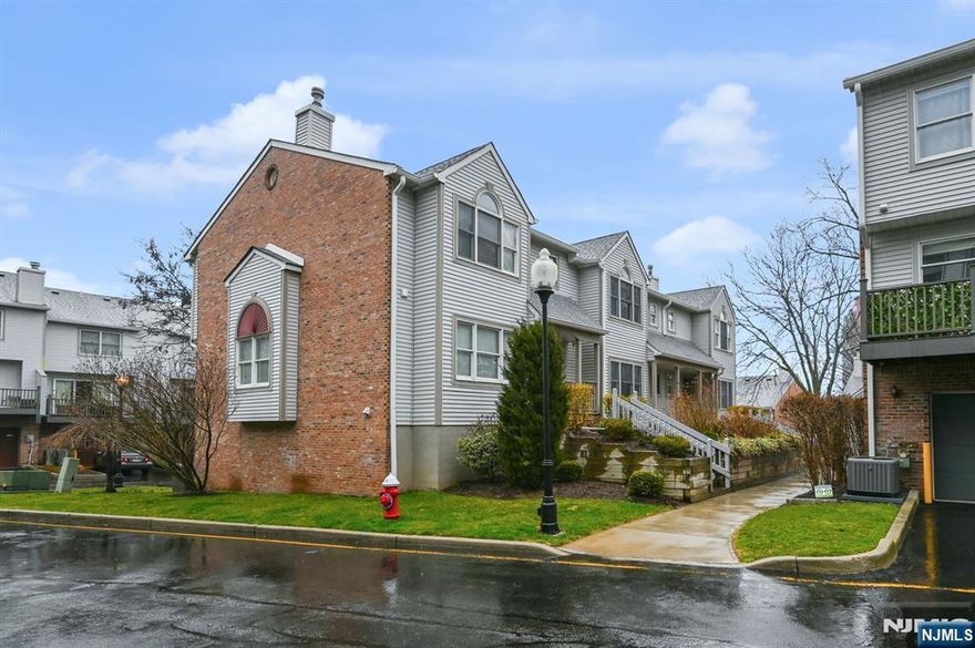 Welcome to 158 Panorama Drive in the desirable Panorama Complex, Edgewater. This bright and spacious home has it all! Enter through a welcoming foyer with a large coat closet and powder room. The open living and dining area features brand-new flooring throughout, a fireplace, crown and chair rail molding, and access to a deck with peaceful sunrise views. The modern eat-in kitchen boasts custom maple cabinetry, stainless steel appliances, granite countertops, and a mosaic tile backsplash. Upstairs are three large bedrooms and two full baths, including a primary suite with vaulted ceilings, a custom walk-in closet with attic access, and an en-suite bath with a jacuzzi tub. The lower level offers a versatile family/rec room, laundry area, and direct access to a two-car garage with custom built shelving, plus two driveway spaces. Conveniently located near transportation, shopping, dining, parks, schools, and places of worship â€” a perfect place to call home!