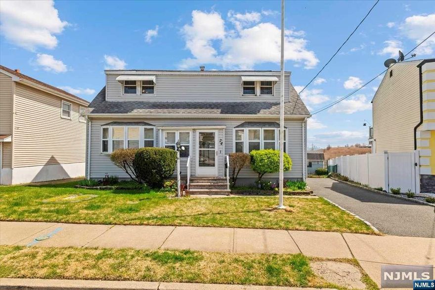 Nestled on a tranquil dead-end street in North Arlington, 24 Geraldine Road offers a perfect blend of comfort and convenience. This charming residence boasts three bedrooms, and two baths, including one bedroom and bath on the main floor, perfect for guests or family members needing easy access. while the renovated bathroom adds a touch of modern luxury. Enjoy breathtaking views of the New York City skyline from various vantage points throughout the home. The partially finished basement offers versatile space for recreation or storage. Don't miss out on this delightful retreat - schedule your showing today!