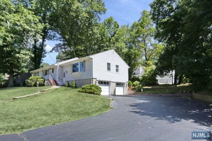 Final and best due by Monday august 22nd 5pm BEST VALUE ON MARKET!!! Oversized & Expanded Ranch with spacious rooms, on large 125x100 lot in a GREAT neighborhood. Home is well-maintained and has great layout & flow with Big rooms & closets...ready for updating to make it your own! Kitchen has newer appliances with door to newly done deck and nature's serenity. Combination Dining Room/DEN is a 1980's addition and HUGE with bright picture window. Master bedroom suite is 1980's addition with master bath and walk-in-closet. Large Living room, 3 additional bedrooms and hall bath complete 1st floor. Lower level has Big Family room with bar, Unfinished storage with laundry, utilities, and powder room(toilet & sink removed), and MASSIVE 2 car garage. Enjoy Grilling and FUN in your private backyard with new Deck...Like being on VACATION everyday! Convenient location for commuting, shopping, dining and activities. House sold as-is. You will LOVE living in this HOME!!!