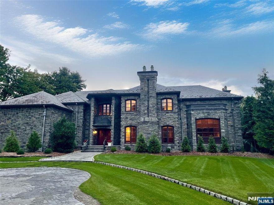 MAHOGANY MANSION! SEE VIDEO! INDOOR POOL, HIGHEST QUALITY CONSTRUCTION, SMART HOUSE, HAND CUT STONE EXTERIOR & ENTRY WALLS & STANCHIONS. TRUE SLATE ROOF W/ HEATED COPPER & LEAD GUTTERS, ZELUCK WINDOWS & MASSIVE IRON RAILINGS. 2 STORY MAHOGANY & MARBLE ENTRY FOYER W/ SWEEPING STAIRCASE AND COFFERED CEILINGS. INCREDIBLE GREAT RM W/ 25' CEILINGS AND STONE FPL. GOURMET CHEF'S KITCHEN, CHERRY CABINETS, MARBLE COUNTERTOPS AND STONE FPL. FDR W/ 12.5' CEILINGS, RECESSED COVE LIGHTING, STONE FPL AND RETRACTABLE WINDOWS. GYM W/ FULL BATH, INDOOR POOL AND SPA, OFFICE, COMMERICAL LAUNDRY. 4 CAR ACCESSORIZED GARAGE W/ 10' DOORS, 16' CEILINGS, UTILITY BTHRM & HEATED. MASTER SUITE W/ SITTING RM, MARBLE FPL, INLAID MAHOGANY FLOORS, SPRIAL STAIR TO KITCHEN. 3 ADDITIONAL LG EN SUITE BRs W/ OUTFITTED CEDAR WICs.