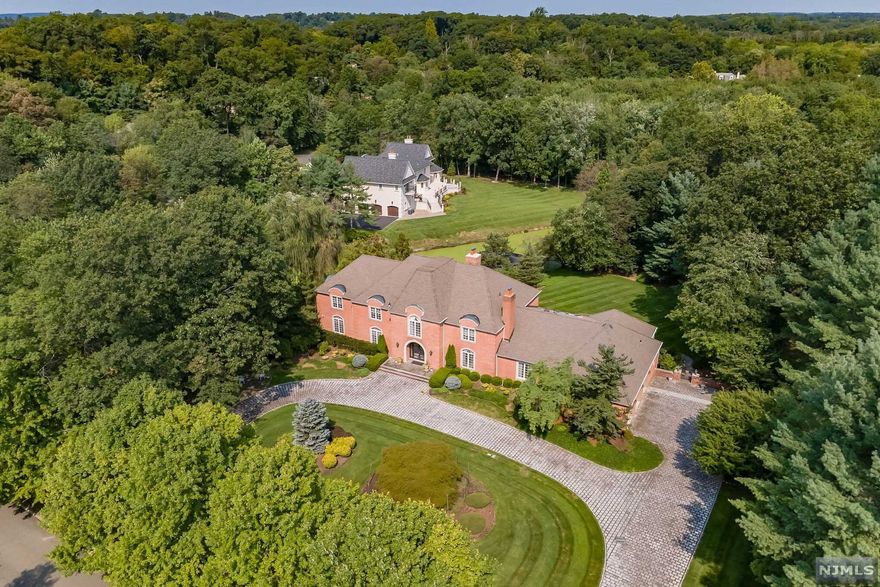 Welcome to 19 Eckert Farm Rd a Custom-built French Country Estate on 2 Acres in the heart of Saddle River. Just 30 mins from NYC this expansive 7 Bedroom 8 Bathroom property is in the highly desirable and sophisticated High Ridge neighborhood. This Estate sits high above and overlooks a captivating private pond with a water fountain and a bluestone walkway down to a tranquil patio seating area. The interior flows effortlessly from room to room starting in the Grand Foyer Marble Entrance. With nearly 8500 sq ft of elegance adorned with Sherle Wagner custom designs throughout. Primary Suite is on 1st floor and equip with a Sauna, Steam Shower and Jacuzzi with all remaining bedrooms on the second level. In addition to the refined landscaped you'll have sufficient privacy in this lushly wooded corner lot. YOUR FAMILY WILL FOREVER THANK YOU FOR THE MEMORIES YOU'LL MAKE HERE TOGETHER!