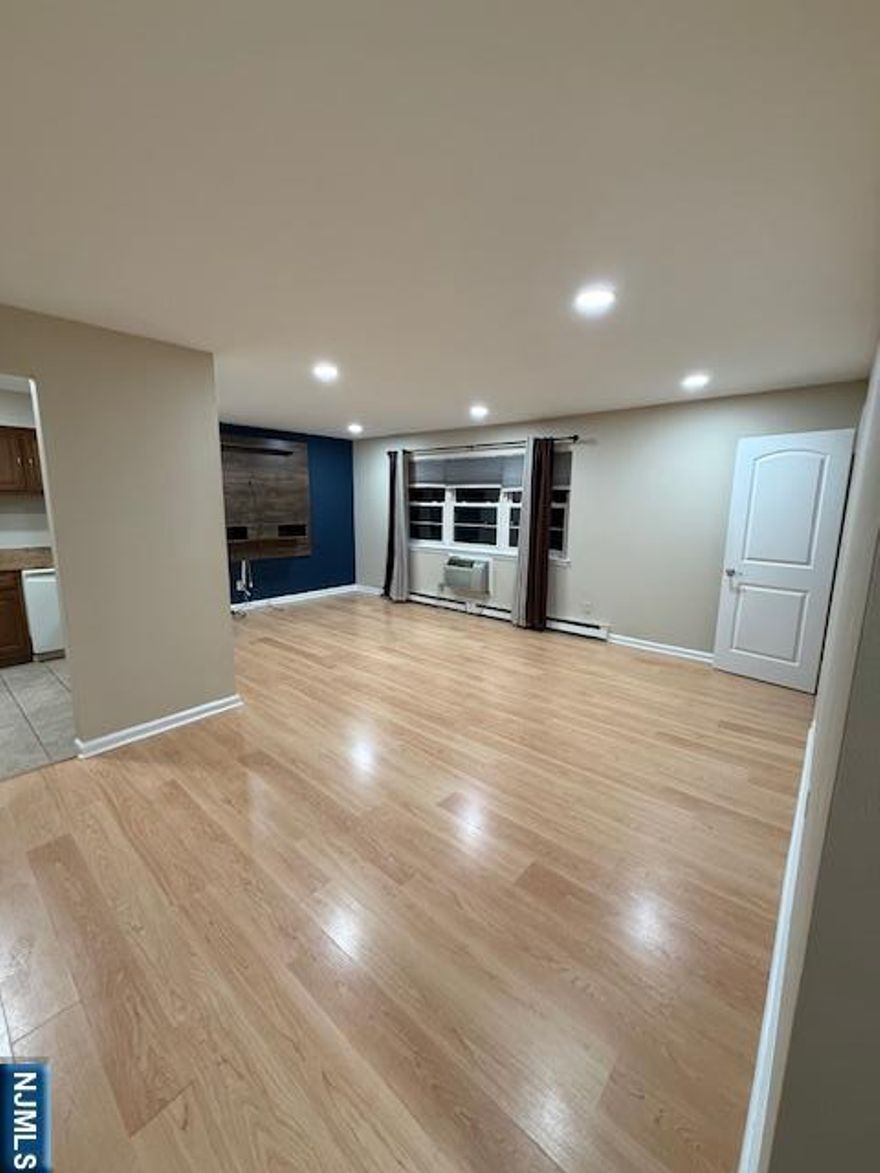 Move right into this immaculate updated 1 bedroom 1 bath condominium located in desirable Pond Ridge. This 2nd floor unit boasts a spacious living room dining room combination with a view of the pond, kitchen with granite countertops, use of the outdoor Weber grill, large bedroom with ample closet space, and an updated bath with convenient stackable washer and dryer. Newly painted and easy maintenance vinyl plank flooring. Close to great restaurants, shops and NY transportation. Don't miss this great opportunity.