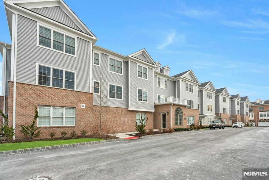 Welcome to wonderful Paris Square,the 50+ active adult community!This light & bright one floor 2 bedrm, 2 bathrm corner unit features an open concept design,showcasing the kitchen w/an over-sized island,quartz counters,herringbone tile backsplash,under cabinet lighting,stainless appliances,dining area & family rm w/lots of windows.Primary bedrm suite w/2 walk-in closets & spa-like full bathrm,stall shower w/rain shower head,vanity w/quartz top & double sinks.Spacious 2nd bedrm,plus additional full bathrm w/Kohler faucets & fixtures.Lots of great features throughout;washer & dryer in the unit,tons of closets,plank hardwood flooring,9â€™ ceilings,LED recessed lighting,video intercom,energy efficient HVAC system,2 indoor underground parking spaces included.Amenities include outdoor pool,clubhouse w/fitness center,billiards rm,resident lounge w/TV & fireplace,movie theater,walking path/park,picnic area w/bbq & community garden.Close to golf courses, shopping, restaurants & transportation.