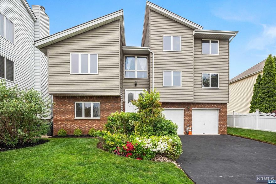 Rare find! Contemporary legal 2-family in best location, tucked away in a cul-de-sac. Income-producing property features 5 beds, 5 full baths across 3 levels. Enjoy spacious rooms & large kitchens w/ newer appliances in both units. The 1st unit duplex offers 3 beds, 2 baths on 1st floor plus a ground floor in-law suite that has another living area, den, summer kitchen, full bath & separate entrance. 2nd unit has 2 beds & 2 full baths. Each unit has its own washer & dryer in the shared laundry room. Outside, revel in the beautifully landscaped fancied in yard w/ a large deck, gas line for grill & a Jacuzzi hot tub. 2-car attached garage w/ 4 additional parking spots. Commuting is a breeze w/ NYC bus nearby & easy access to major Rts. such at 3, 17 & 21. Minutes away from both Westmont & Rutherford train stations. Close to grocery stores like Shop Rite and Stop & Shop. Entertainment at American Dream Mall & Meadows Sports Complex. Central air 2016, Roof 2013. NOT in a flood zone!