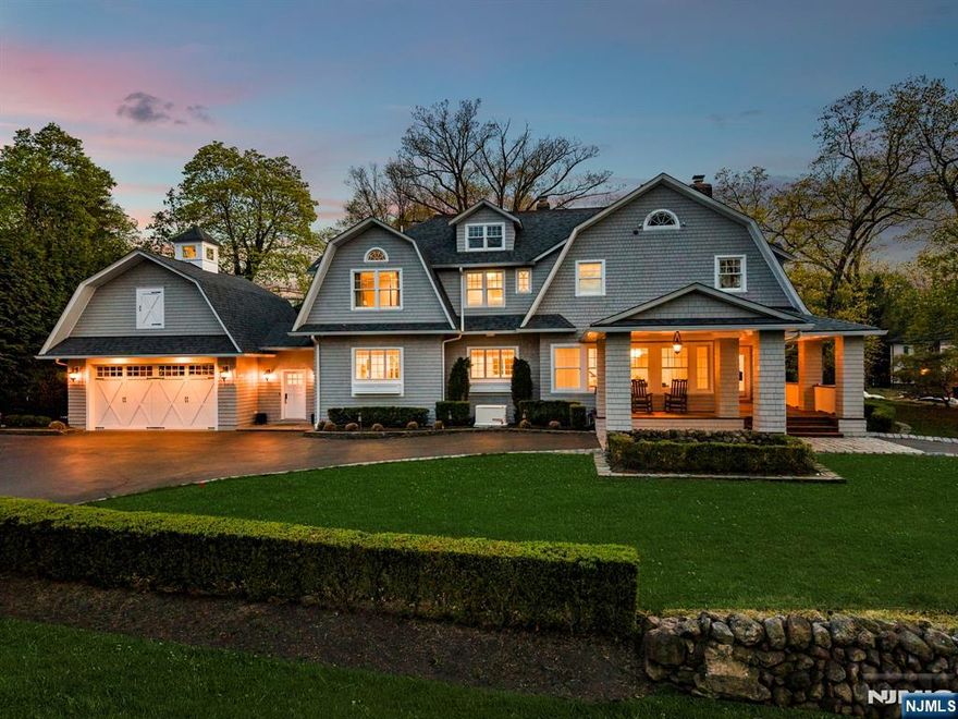 Hamptons-inspired Dutch Colonial fully reimagined through a comprehensive structural and design renovation blending classic architecture with modern finishes. Steel beam and column reinforcement anchors the home, paired with custom millwork, wainscoting, and coffered ceilings throughout main living spaces. Gut-renovated kitchen with custom Miter Box cabinetry, double island, walk-in pantry, built-in coffee station with sink, and integrated Thermador appliances including paneled refrigerator and freezer columns, double dishwashers, dual-fuel range with induction, multiple ovens, warming drawer, and refrigeration drawers. Butlerâ€™s pantry adds Sub-Zero freezer drawers, paneled beverage refrigeration, full-height wine column, ice maker, and sink. Radiant heat extends through kitchen and tiled surfaces. Five bedrooms upstairs including redesigned primary suite with dual walk-in closets, marble bath with steam shower and freestanding tub. Renovated hall bath and first-floor laundry, plus second-floor laundry with LG WashTower. Finished lower level offers new flooring, large recreation area, custom 1,200-bottle wine cellar, and additional laundryâ€”three total, one per floor. Ubiquiti UniFi networking and Sonos audio inside and out. Backyard redesigned with porcelain pavers, outdoor kitchen, freestanding jacuzzi, landscaping, and motorized louvered pergola (2026) with fans and heaters. Updated exterior paint, new rear staircase, roof replaced in 2023 with extended warranty.