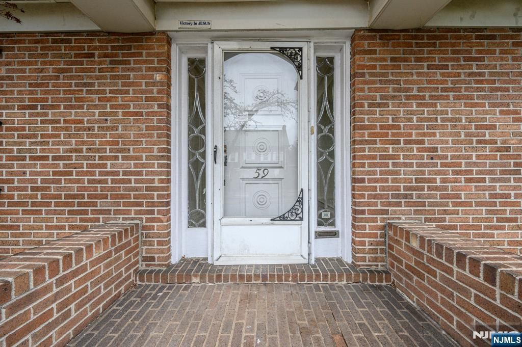 Photo of 5761 Pomona Avenue, Newark, NJ 07112 (MLS # 26009995)