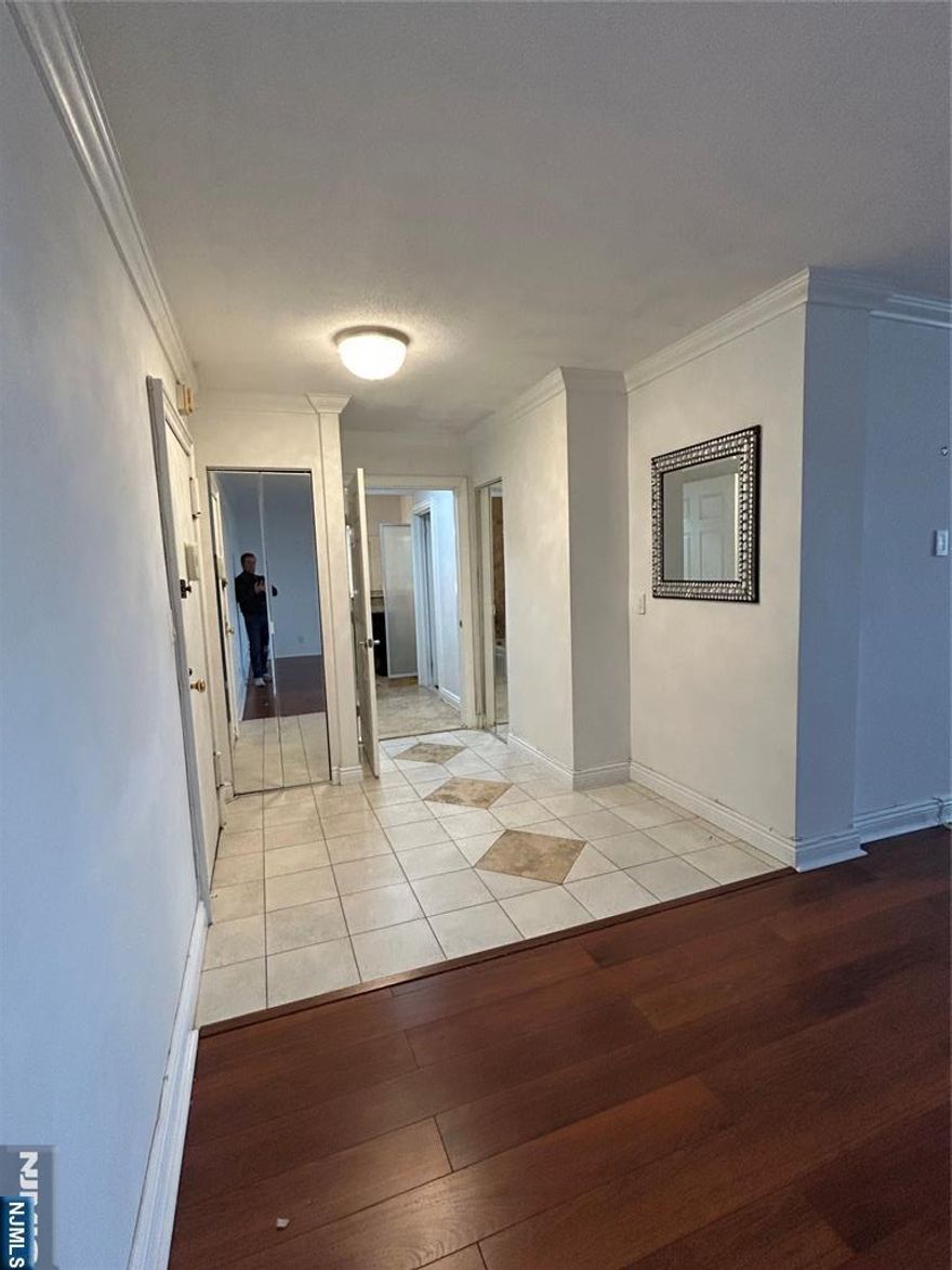 Welcome to sought-after Northbridge Park! Beautifully updated oversized one bedroom one bath west facing "W" line on upper floor. Entry foyer with ceramic tiled floor, large bright living room with engineered wood flooring, renovated eat-in kitchen with custom cabinets, granite counter tops, ceramic tile floors and access to private covered balcony. Sizable bedroom with large closet, engineered wood flooring and access to renovated full bath offering a shower/tub combination, travertine marble flooring and shower surround. Creative work space accessed from the bedroom or foyer. Amenities abound! Recently renovated lobby and common areas, doorman/security, on-floor laundry, Exercise room, Tennis, Pickle, Heated pool, Childs play ground, On-site management. Come see, there's more! OPEN HOUSE SUNDAY 2/22 from 11A to 1P COME SEE! Downtown Fort Lee at your doorstep offering retail, shopping, restaurants! Nearby Park, House of worship, School. EZ access to mass transit, GWB and NYC.