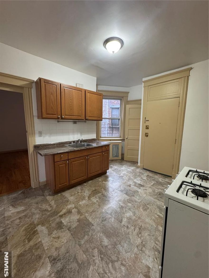 Bright and refreshed 2-bedroom apartment with spacious bedrooms in a walk-up building, perfectly situated just one block from NYC transportation for an easy commute.