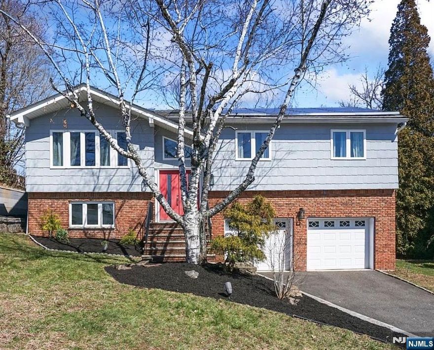 Nestled on a quiet cul-de-sac in a highly desirable location near premier shopping, dining, this beautifully appointed 4-bedroom 3 bath residence offers the perfect blend of space, style, and functionality. The home welcomes you with soaring ceilings and expansive skylights that flood the interior with natural light, creating an airy and inviting ambiance throughout.At the heart of the home lies a stunning open-concept kitchen, thoughtfully designed for both everyday living and entertaining. A massive granite island anchors the space, complemented by ample cabinetry and effortless flow into the dining and living areas. Just beyond, a sprawling deck extends off the kitchen and dining room?ideal for hosting gatherings or enjoying quiet outdoor moments.The main level features three generously sized bedrooms, including a luxurious primary suite that boasts a beautifully designed en-suite bathroom complete with a walk-in shower, elegant marble flooring, and a spacious walk-in closet.The lower level offers exceptional versatility, featuring a fourth bedroom, full bath, and living area for guests, or a private office, Direct walkout access to the patio, connecting indoor and outdoor living. Additional highlights include an attached two-car garage, full-house central vacuum system, solar panels that provide energy efficiency and long-term savings. This exceptional home combines modern comfort and design in a peaceful, commuter-friendly location.