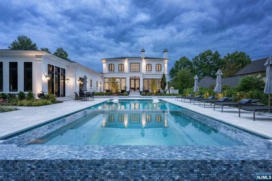 This stunning gem was masterfully crafted in 2018 by architect Rosen Kelly Conway, boasting an impressive 6/7 bedrooms and 7.2 lavish baths with radiant heated floors all sprawled across almost an acre of private property. Every inch of this home is adorned with exquisite custom features, including Lutron lighting and shades uses control4. A spectacular soundproof home theater with state of the art technology, Meridian surround sound digital and audio. You'll been amored by the grandeur of the 10 and 11-foot ceilings throughout, adding a sense of spaciousness, imported french oak flooring, The magnificent gourmet chef's kitchen is a culinary dream come true, featuring seamless custom cabinetry done by Heidi Piron, top of the line appliances Wolf 48inch dual fuel double ovens, Sub-zero and Miele. No detail spared. Step outside and immerse yourself in the professionally landscaped front and backyard, resort style outdoor glassfire pit, an 45X20ft pool with 8x8ft serenity spa