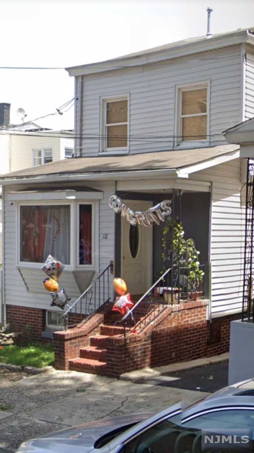 Well Kept Colonial with 3 good size Bedrooms, Large LR/FDR. LR has ornamental Fireplace. High ceiling Finished Basement. Driveway with detach one car garage. Gas Force Air Heat with Central Air. A real must see!