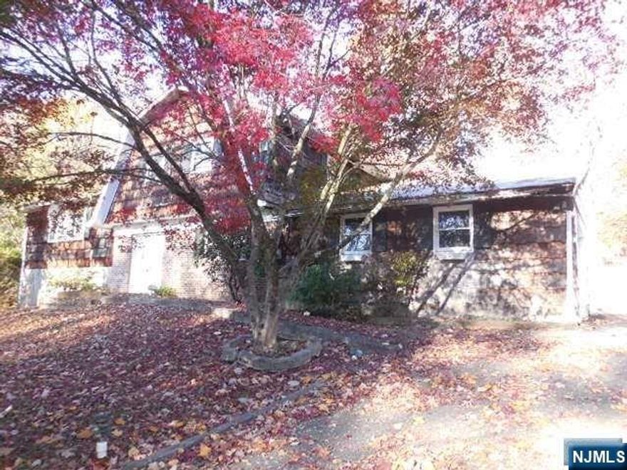 Spacious Split-Level style home with an attached In-Law suite located on a large 1.36 acre lot. Home in need of a complete renovation inside & out. Partially finished basement. 2 Car Attached garage with loft storage & plenty of driveway parking. Nice quiet neighborhood & very close to Cupsaw Lake. Property is being sold in absolute "as is" condition. All town required inspections to close are responsibility of the purchaser as well as all final water & utility bills.