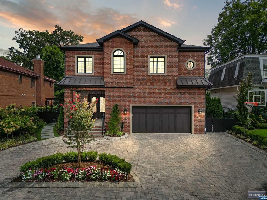 A stunning home with 6-bedrooms, 5-bathrooms, all-brick side hall colonial located on a charming tree-lined street in a highly sought-after section of Fort Lee. Inside you're welcomed by a 2-story grand foyer and a bridal staircase, living room and a flex family/dining rm with a picturesque view of the the serene private backyard. The Chef's eat-in kitchen boasts stainless steel appliances, a spacious center island with a breakfast area, and glass doors that lead to the inviting custom built outdoor cooking area. Upstairs, the second floor hosts a generously sized primary suite, a luxurious spa bathroom, and two walk-in closets. Additionally, you'll find one more ensuite bedroom, with its own walk-in closet, plus an additional 2 large bedrooms with a hallway bathroom. The fully finished basement is an entertainer's paradise, a recreation room, gym, guest bedroom and full bathroom. This exceptional home offers luxury, perfectly suited for both relaxation and entertainment.