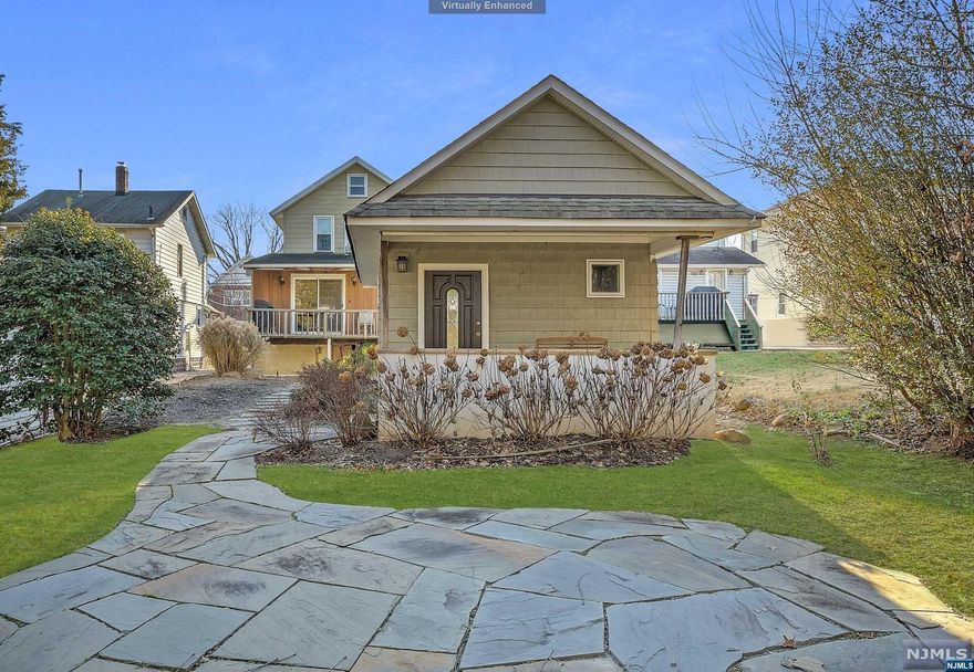 On market for the first time in +50 years! This 3 bedroom, 2 bath offers an additional room in the back that could easily be used as a 4th bedroom- with sliding doors to deck and an en-suite bathroom. Beyond the entry is a living room, open to the dining room. An eat in kitchen, full bath, and the bonus room. Upstairs you will find 3 bedrooms and additional full bath. There is a partially finished basement, accessible through stairs off the kitchen or the bilco doors. A large detached garage built in 2009, with the bonus of a charming porch off the back- which overlooks a gorgeous bluestone patio, it is the perfect space to get some shade or set up a bar for your barbecue. Other highlights include mature landscaping, underground sprinkler system, a deck, and bilco doors to basement. There is believed to be hardwood beneath carpeting. Bring your vision and turn this property into your perfect home in Nutley. Property is in overall operating condition but sold strictly as-is.