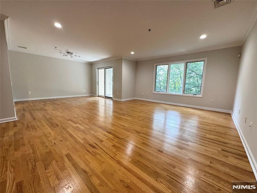 FRESHLY-PAINTED TOP TO BOTTOM. Spacious & Sunny 3-bedroom+BONUS ROOM; 2.5-bathroom apartment in gated Legend Hills community in south end of Edgewater, with appx 2000 sqft living area. 2 dedicated parking spaces plus garage. Premium appliances built for owner comfort. Hardwood floors; updated bathrooms; master bathroom in Dolomites marble. Master bedroom and living room have direct view of the city skyline. 5 min walk to public transportation. Short walk to the Boardwalk and the City Place offering retail stores, restaurants and fitness center. Dual zone air conditioning and heating.